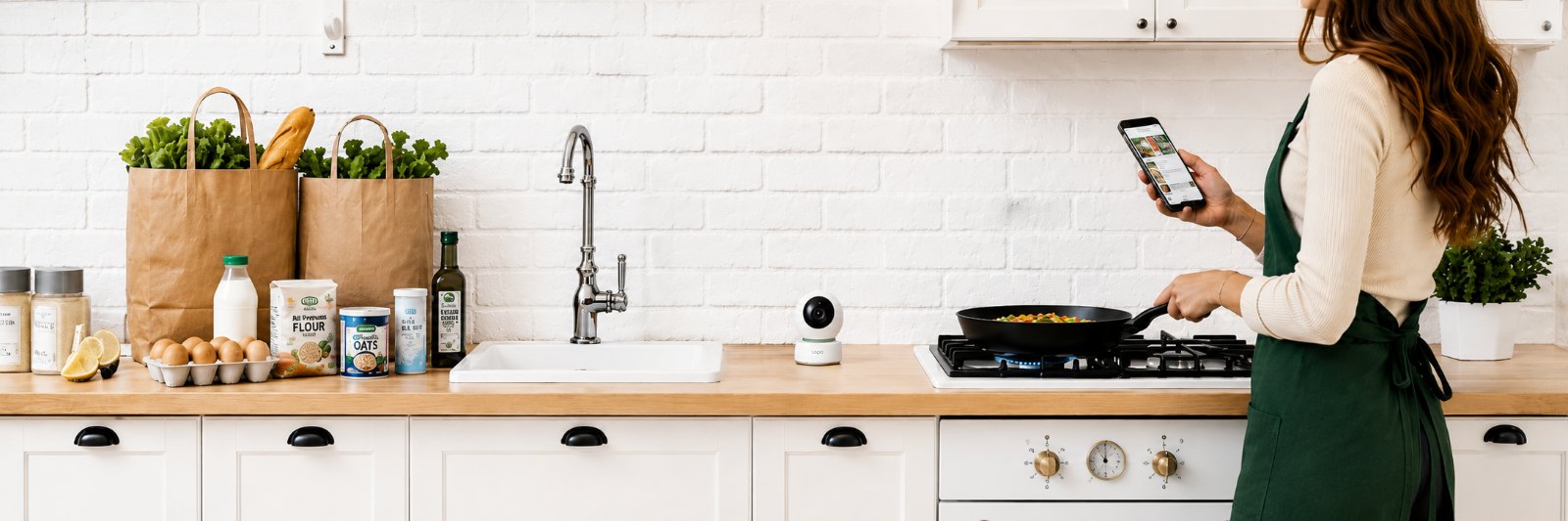 A kitchen scene showing groceries on the counter, a Calfo camera tracking the space, and someone cooking on the stove